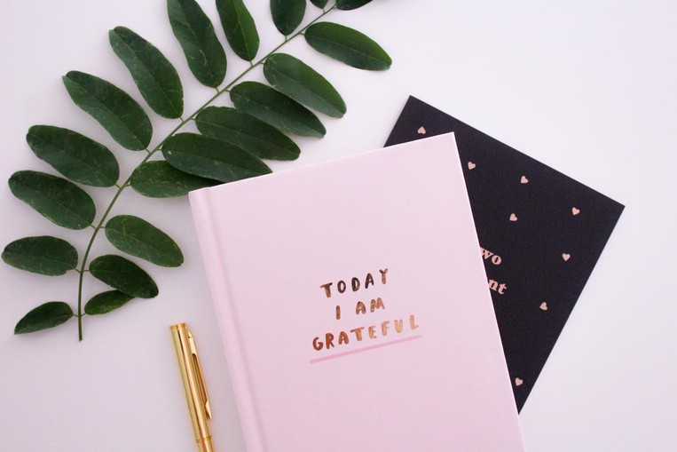 journal with the words "today I am grateful"