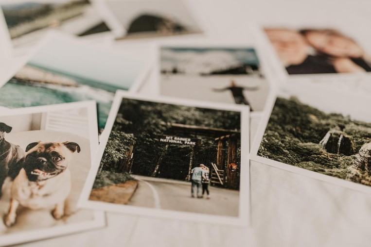 Polaroid photos laid out on a table.